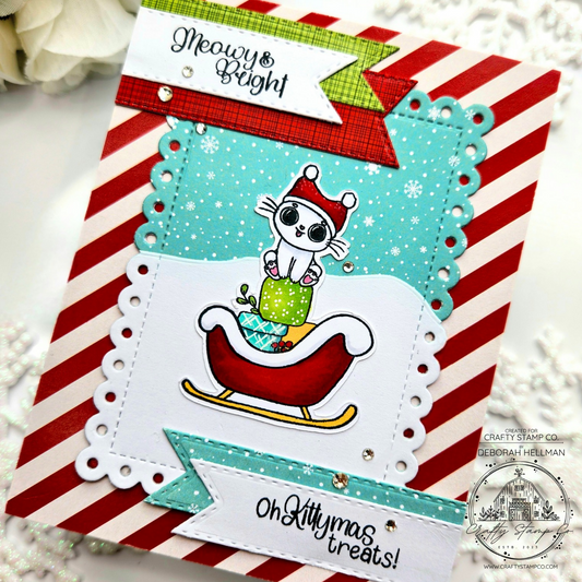 Handmade Christmas card featuring a cute kitty in a sleigh with peppermint striped background and snow scene, created by Deborah using the Meowy Kittymas stamp set for Crafty Stamp Co.